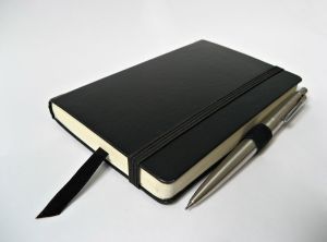 1175999_black_notebook_with_pencil